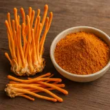 Cordyceps militaris mushrooms and cordyceps powder in a bowl