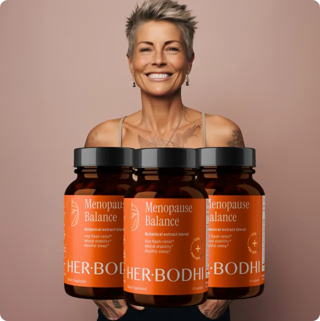 Woman holding three bottles of Her Bodhi Menopause Balance, a three-month supply