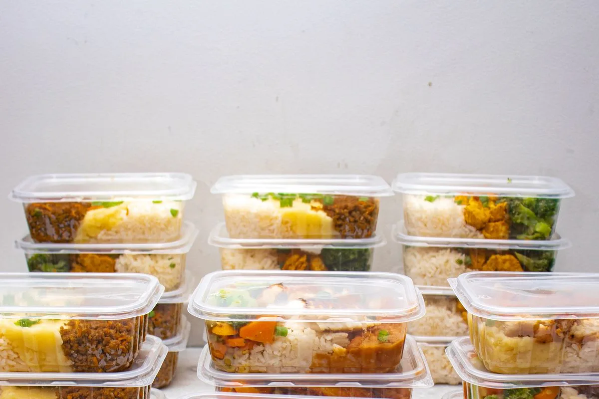 Prepared meal containers with rice, vegetables and protein for the week